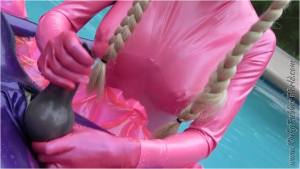 Kinky Rubber World - Latex Lara - Lara playing with Rubber Jeff in Latex Blindmask on the Pool Float