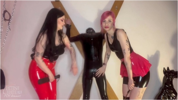 Fetish Chateau Dommes - 2 Latex Mistresses spanking rubber gimp on the cross