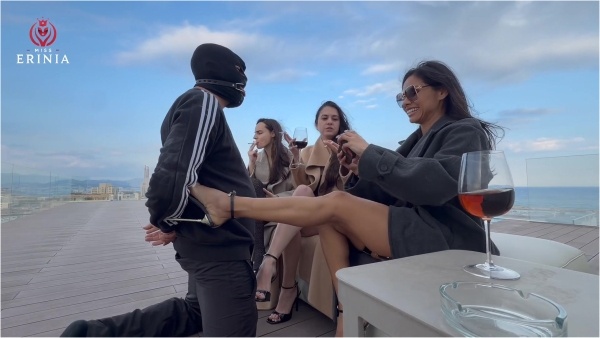 Mistress Erinia, Domme Hades, and Mistress Samantha - The three Mistresses humiliate the slave on the rooftop